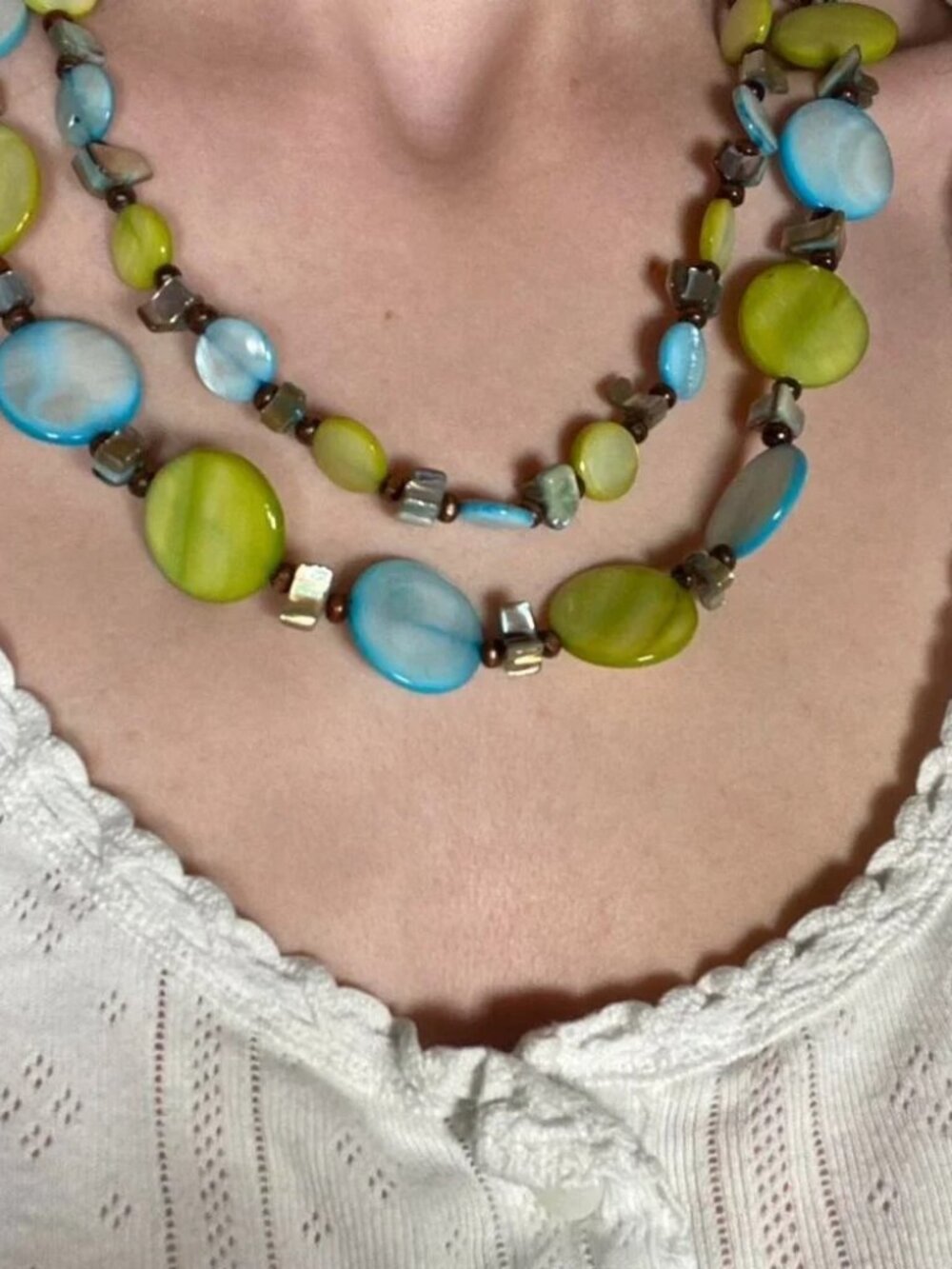 Vintage layered beaded necklace in shades of blue, green, and earthy brown
